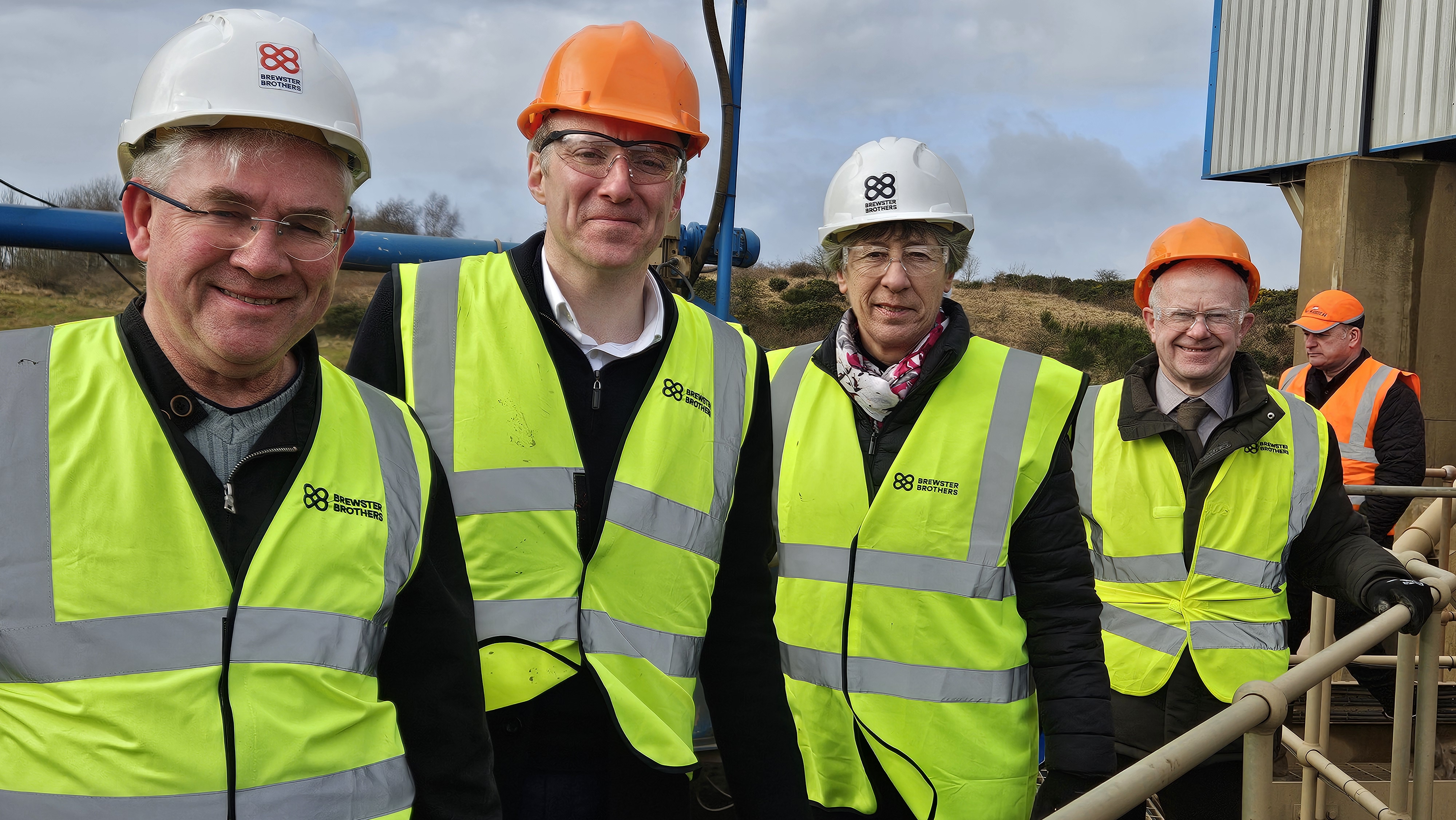 A close up photograph of four Finance and Public Administration Committee Members during the fact-finding visit at the Brewster Brothers aggregates recycling facility in Livingston